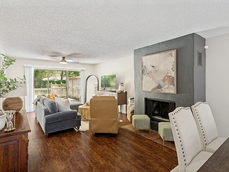 looking to the back sliding door and fireplace