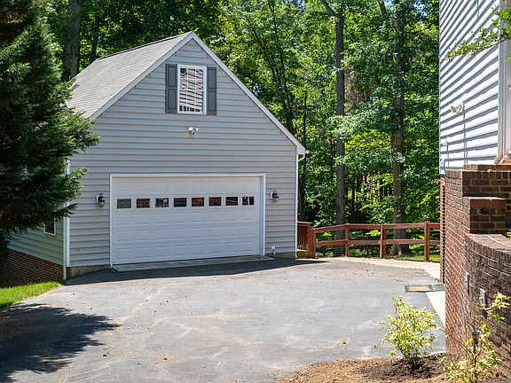 Oversized 2-car garage offers plenty of storage. Second level storage area is accessible by pull down attic stairs