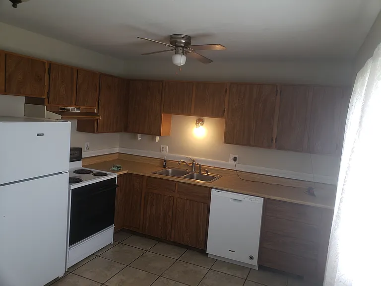 Kitchen now has a larger refrigerator that is not pictured here