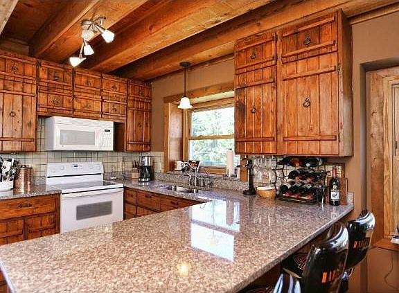 Beautiful custom cabinetry with solid surface countertops.