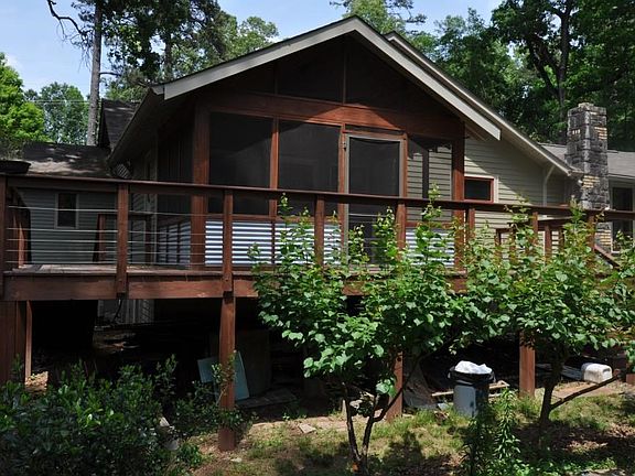 View of screened back porch and deck