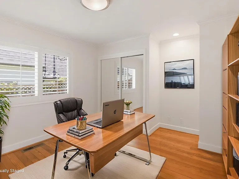 Middle bedroom staged as an office. Image digitally altered.