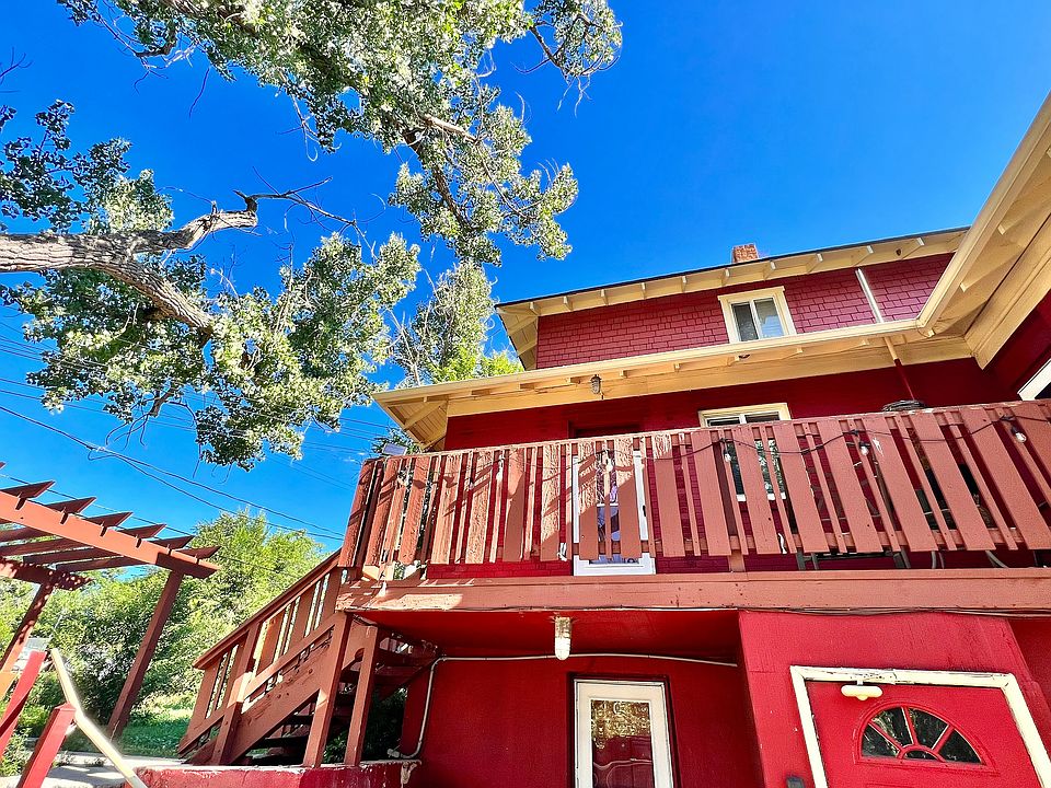 Experience the charm of this delightful red brick home with a welcoming balcony.