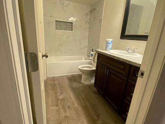 Master bathroom, brand new tub and tile, new flooring