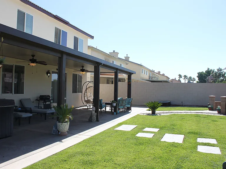 Spacious backyard with covered patio