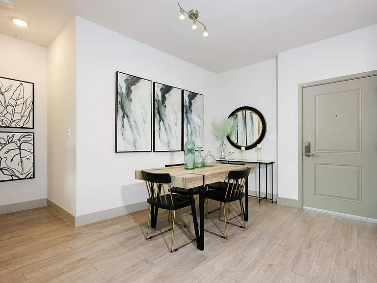 Elevate your living with modern design and a touch of elegance at The Edison Daytona Apartments. This inviting dining area features sleek furnishings and ample natural light, perfect for gatherings. Schedule your tour today!
