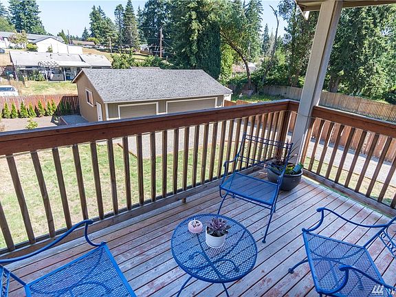 Covered balcony to enjoy the nice summer weather!  This is off of the kitchen and dining area. 