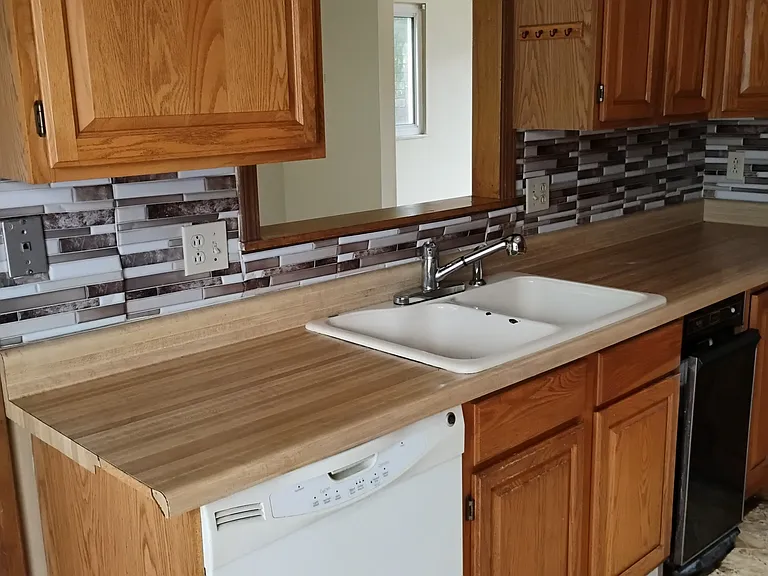 Kitchen sink with area view of dining-room