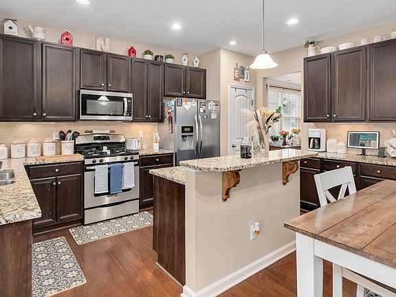 Kitchen connects to dining room on other side