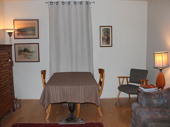 Living room: hardwood flooring, new paint, draperies. (shown here furnished).