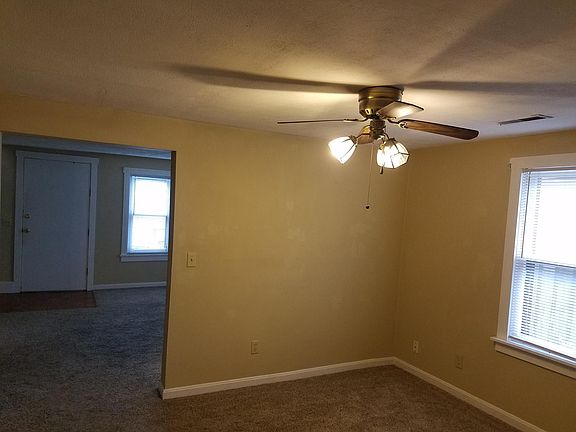 Dining room with lighted ceiling fan
