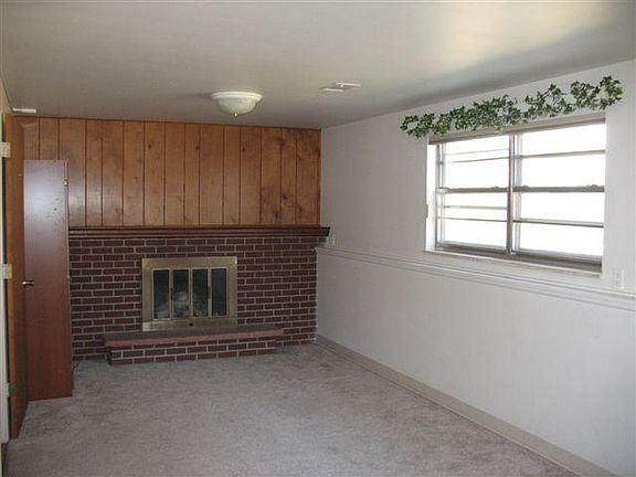 Upper bdrm is 11 x 22. This shows half of the upper bdrm. Fireplace not working.