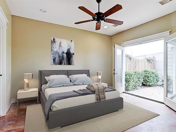 This is a virtual staged photo of what the master bedroom might look like with furniture.