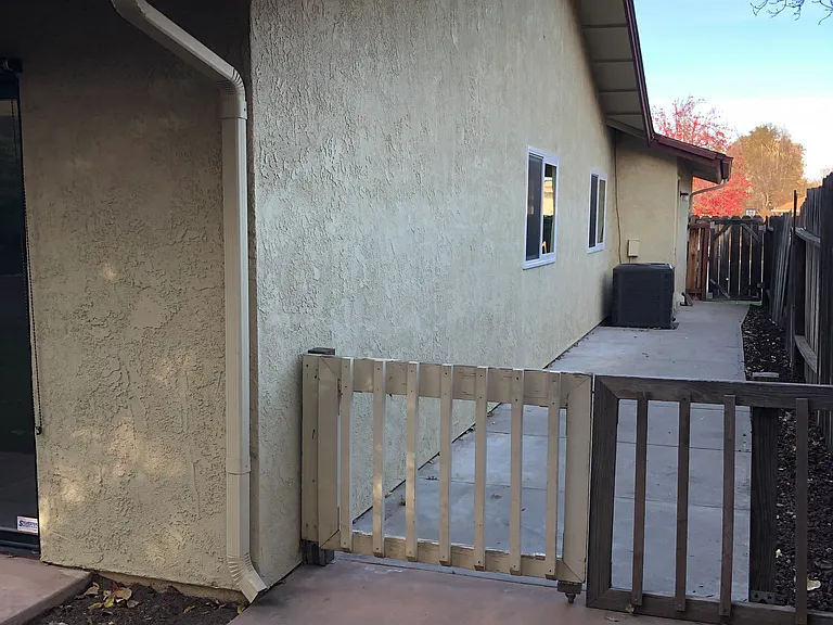 Side yard with new AC/Heating unit