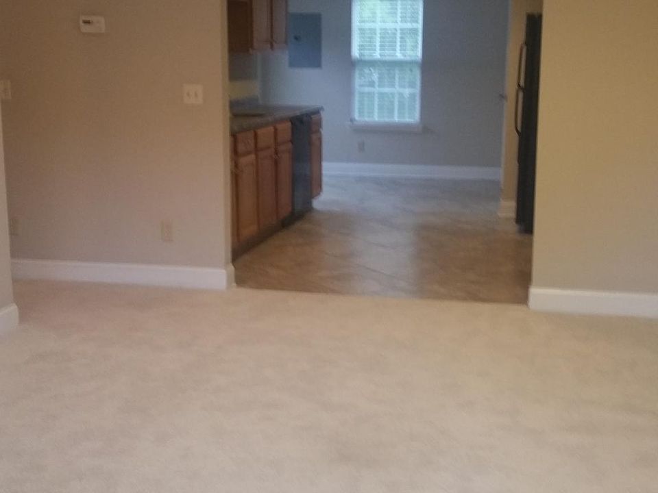 View from front door looking into Living Room, Kitchen, and