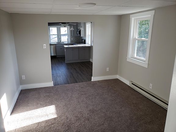 View through living room into kitchen.