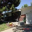 Covered front porch, well maintained and attached garage