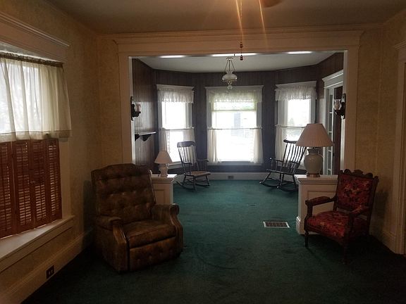 Bright front room connecting to living room.