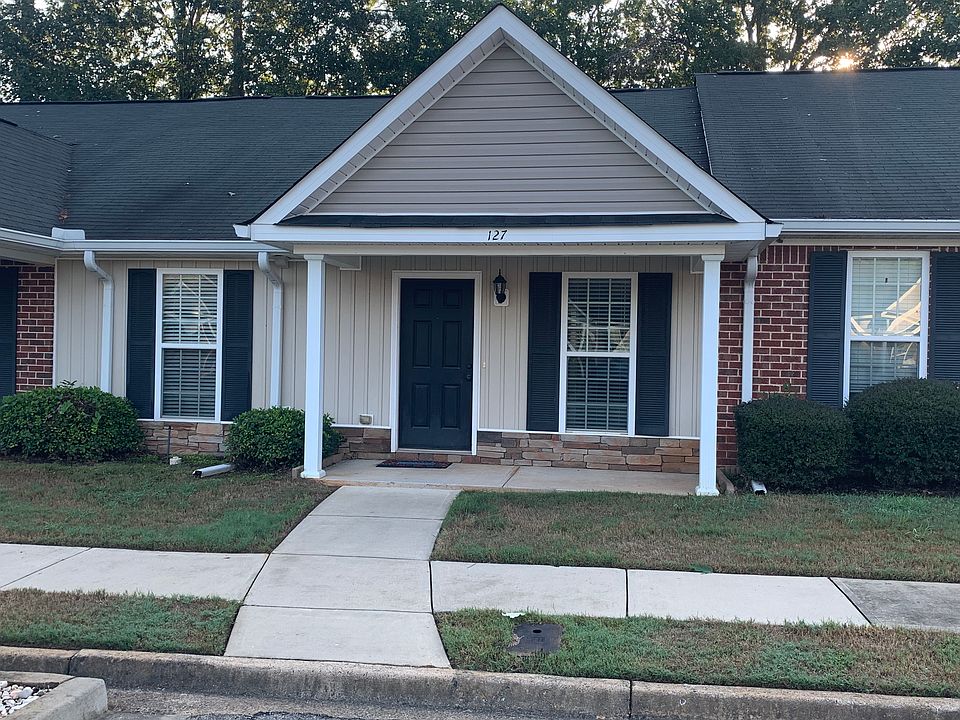 Front door with porch - room for seating area.