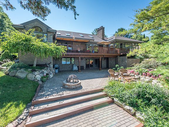 More than meets the eye. Casual elegance flows through the home to the water's edge. An extensive pa