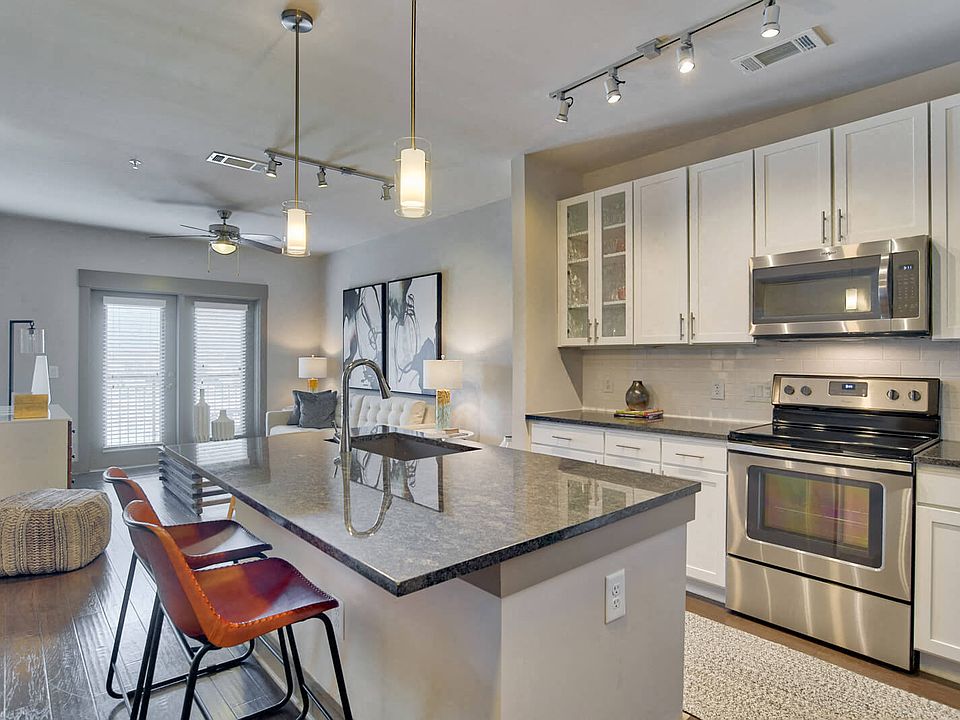 Kitchens feature granite countertops and custom maple cabinetry