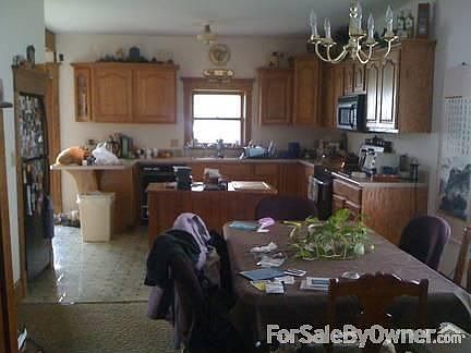 Dining and kitchen area : Open floor plan with oak cabinets