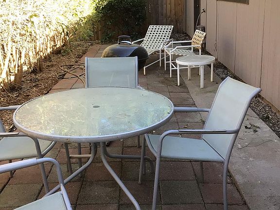 Back patio, additional and larger backyard area, not in photo, for a dog. The entire yard is fenced. More photos coming.