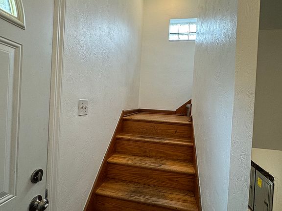 Entry foyer -Stairs to upper unit 2 and basement