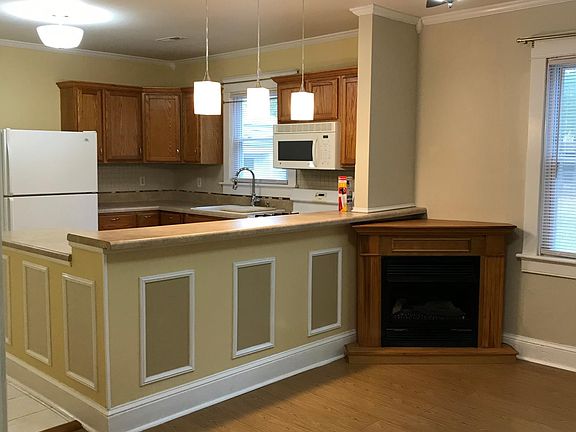 Decorated with modern LED lighting, and white ceramic tiles that transition to medium-dark engineered laminate flooring and a ventless gas fireplace. The home comes fully equipped with Smoke detectors and carbon dioxide detectors as well as a fire extingu