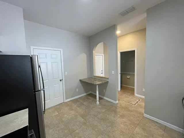 Kitchen looking at 1/2 bathroom
