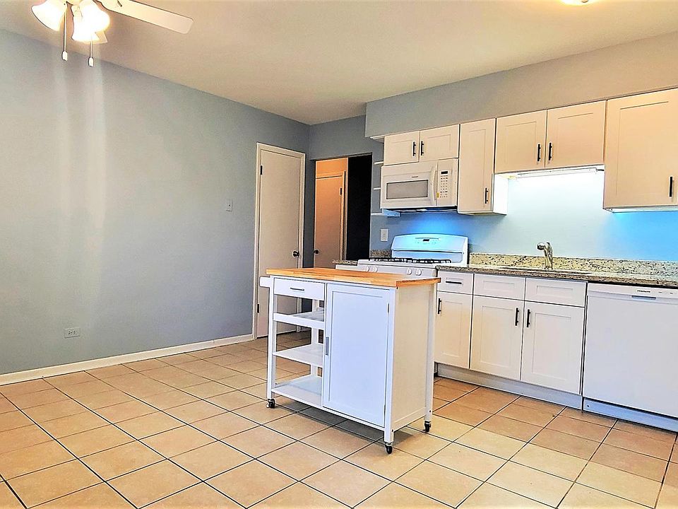 Kitchen. Comes with a roll-away island for extra storage and counter space.
