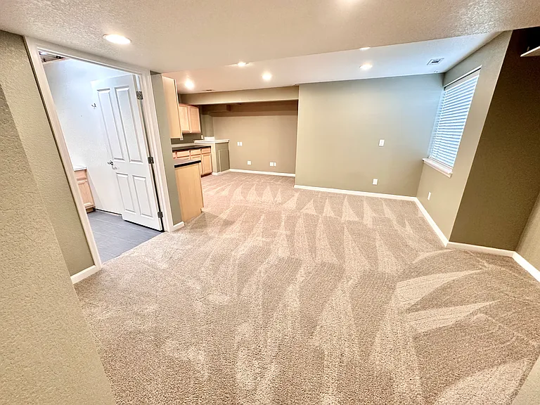 Finished basement with office space, half bath, and laundry.