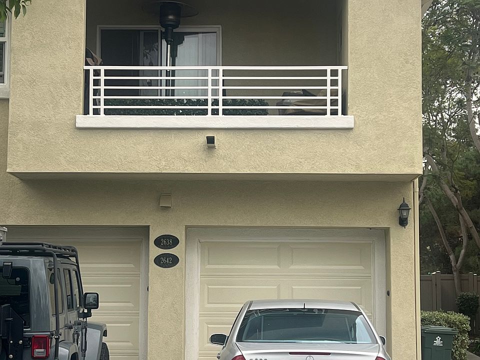 Front view. Attached one car garage. With balcony