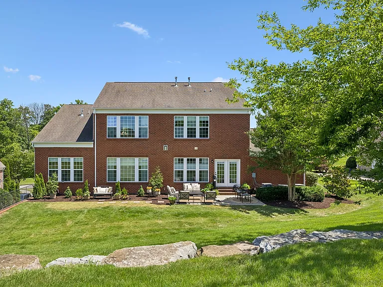 Outside, the backyard offers the perfect balance of usable green space & outdoor entertaining areas. Mature trees, professional landscaping, & multiple seating areas create a private setting for relaxing, dining, & gathering with family and friends!