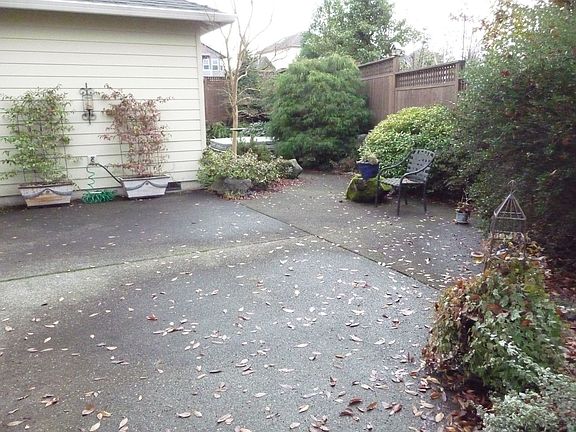 Fully kandscaped Backyard including water feature and in ground hot tub