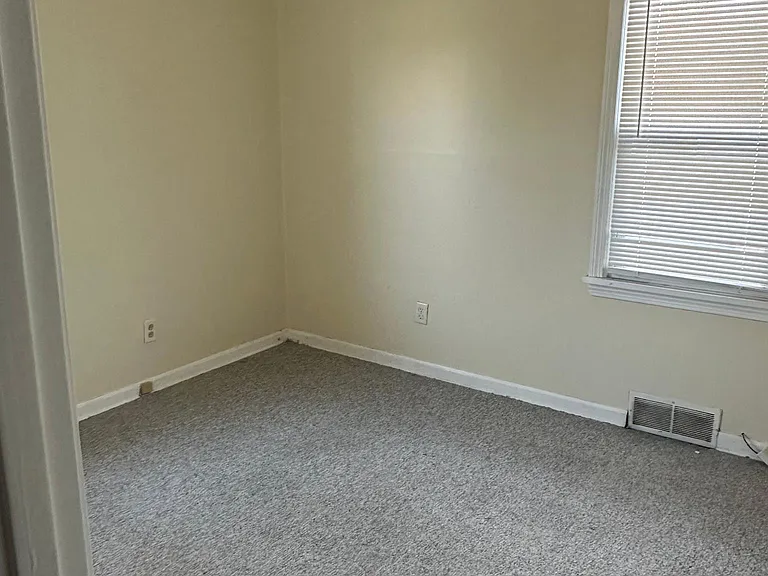 Bedroom 2 with ceiling fan in the first floor