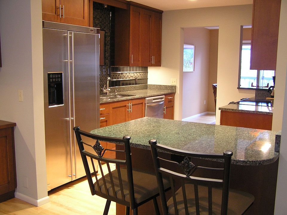 Open floor plan with kitchen opening to gathering room and dining room