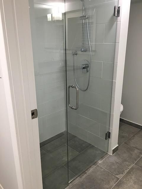 Zero entry shower with glass door