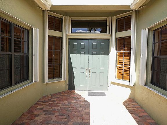 7036 Antinori Lane Accordion Shutters