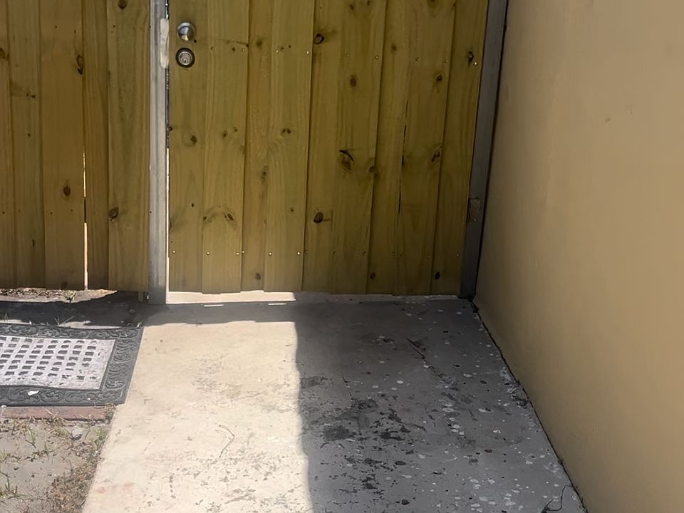 Property Entrance next to parking space.