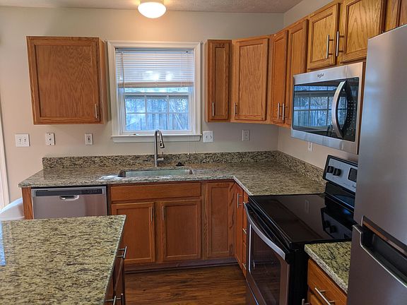 Kitchen with granite countertops and brand new appliances