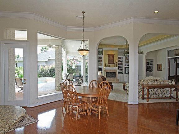 View from the kitchen shows off the extensive wood flooring & open floorplan