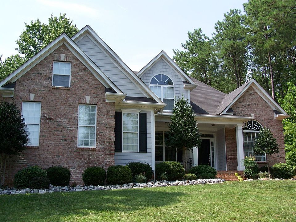 Water view with hard wood flooring on .89 acre with a jacuzzi