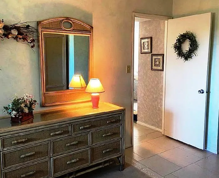 master bedroom door open to hallway to living room.