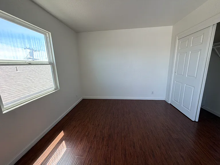 Un-staged photo of the upstairs bedroom.
