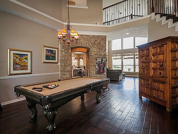 Entry way with wood floors. Crown molding. Beautiful view through the 6 windows.