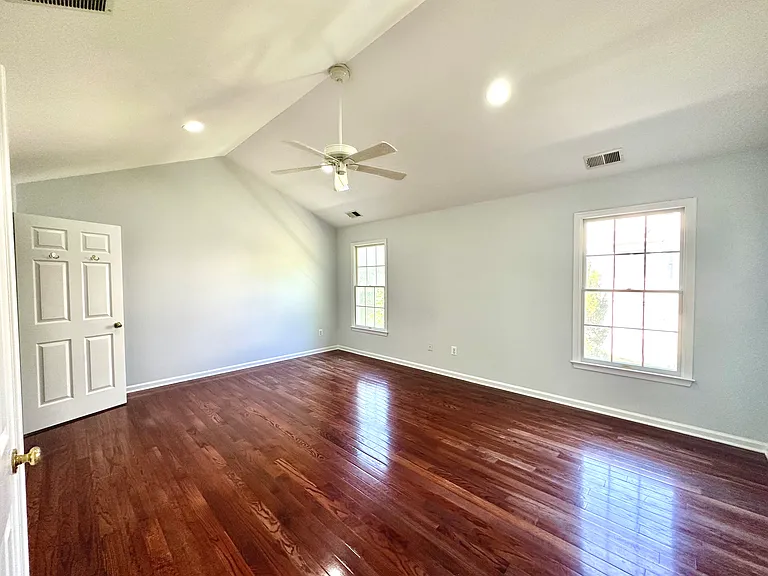 Beautiful Primary Bedroom with Cathedral Ceiling and beautiful cherry floor