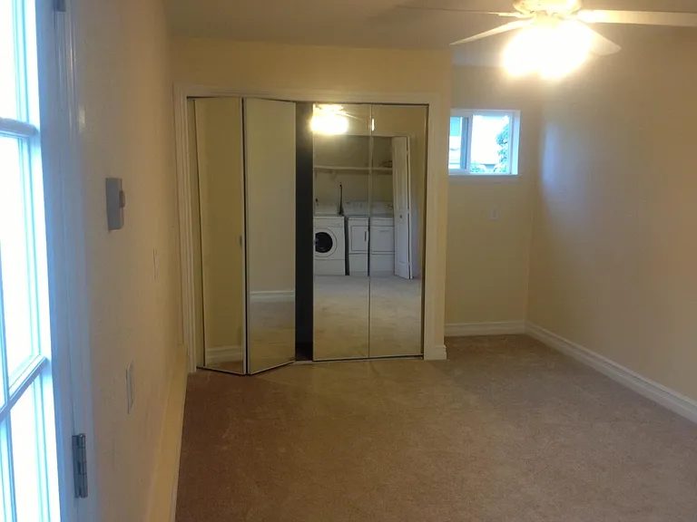 Downstairs 2nd bedroom and built in laundry