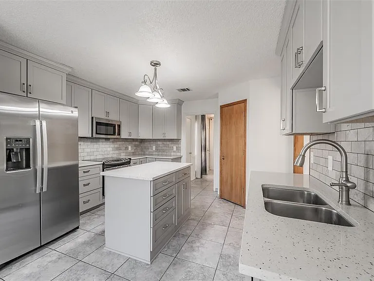 ANOTHER VIEW OF THE KITCHEN