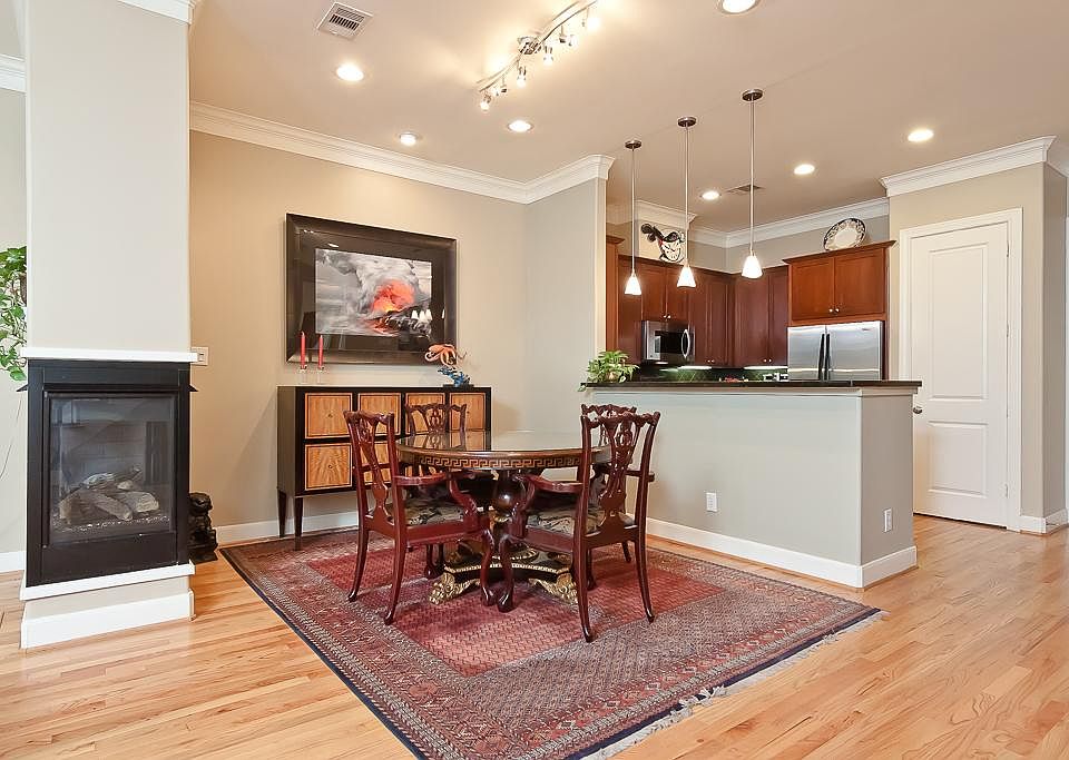 FIRST FLOOR-The dining room features  gaslog fireplace and lighted art niche.